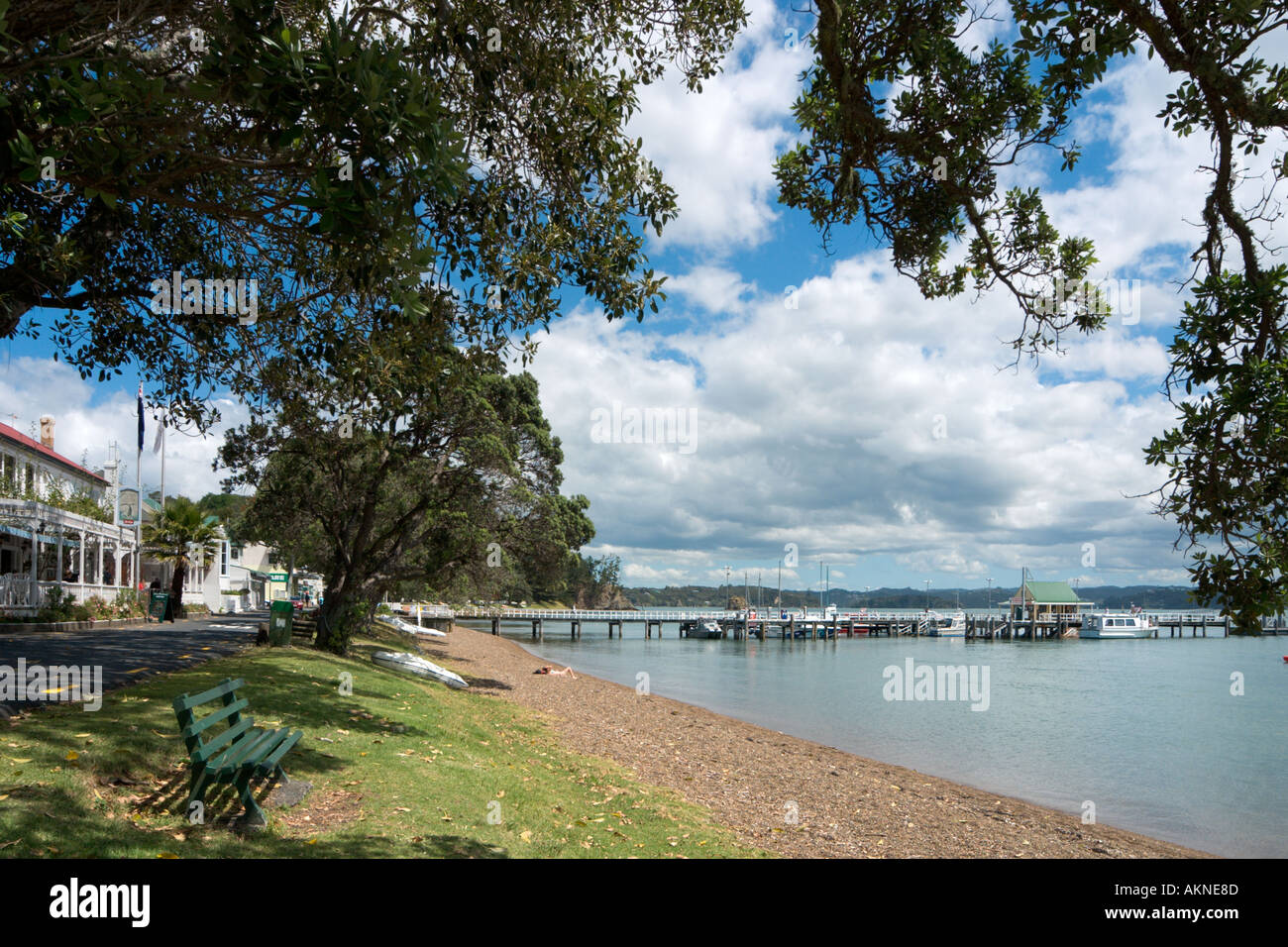 Beach with the Duke of Marlborough Hotel just visible on the left, Russell, Bay of Islands, Northland, North Island, New Zealand Stock Photo