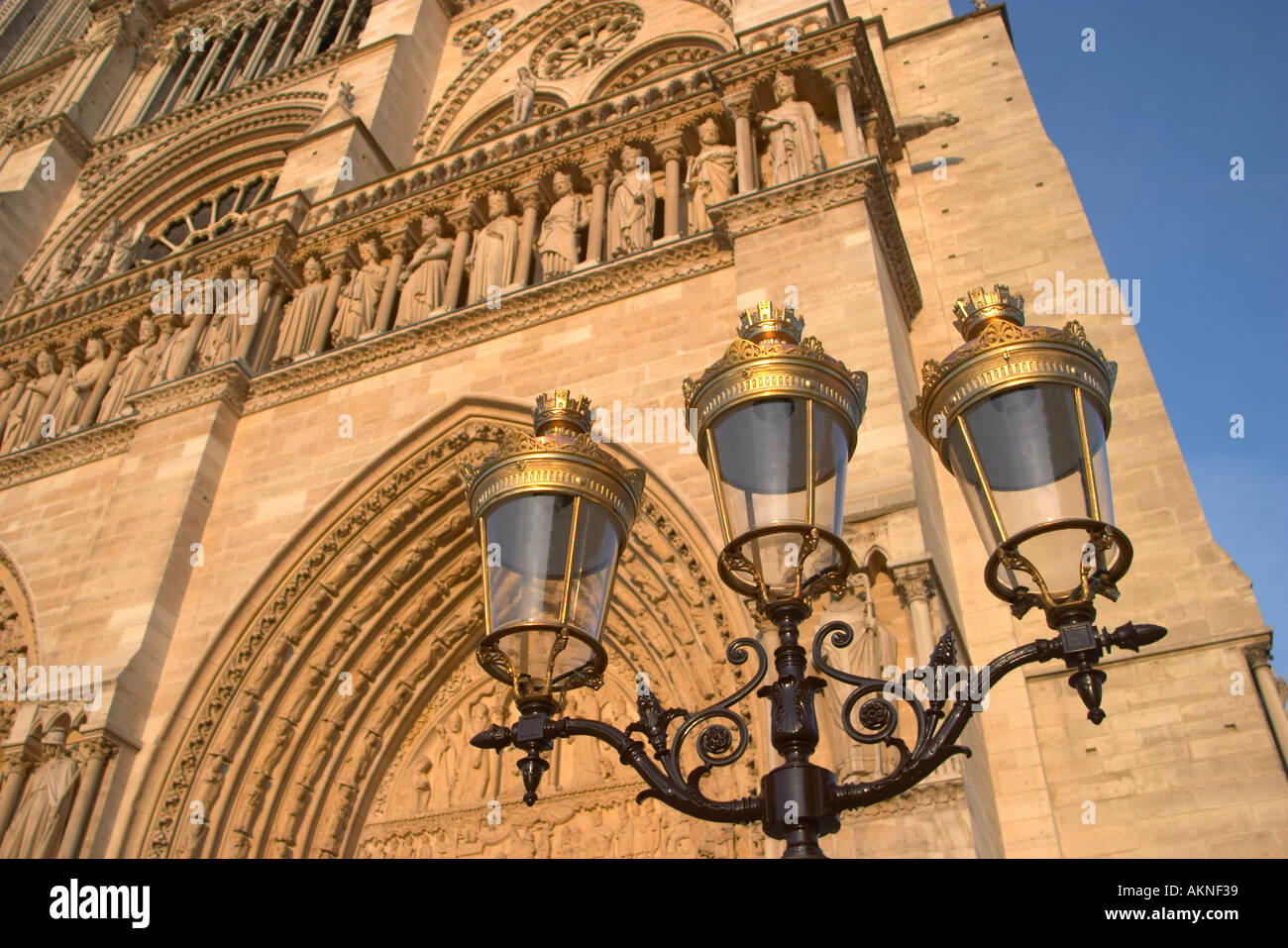 Brass lamps in front of the Notre Dame Cathedral Paris France Stock ...