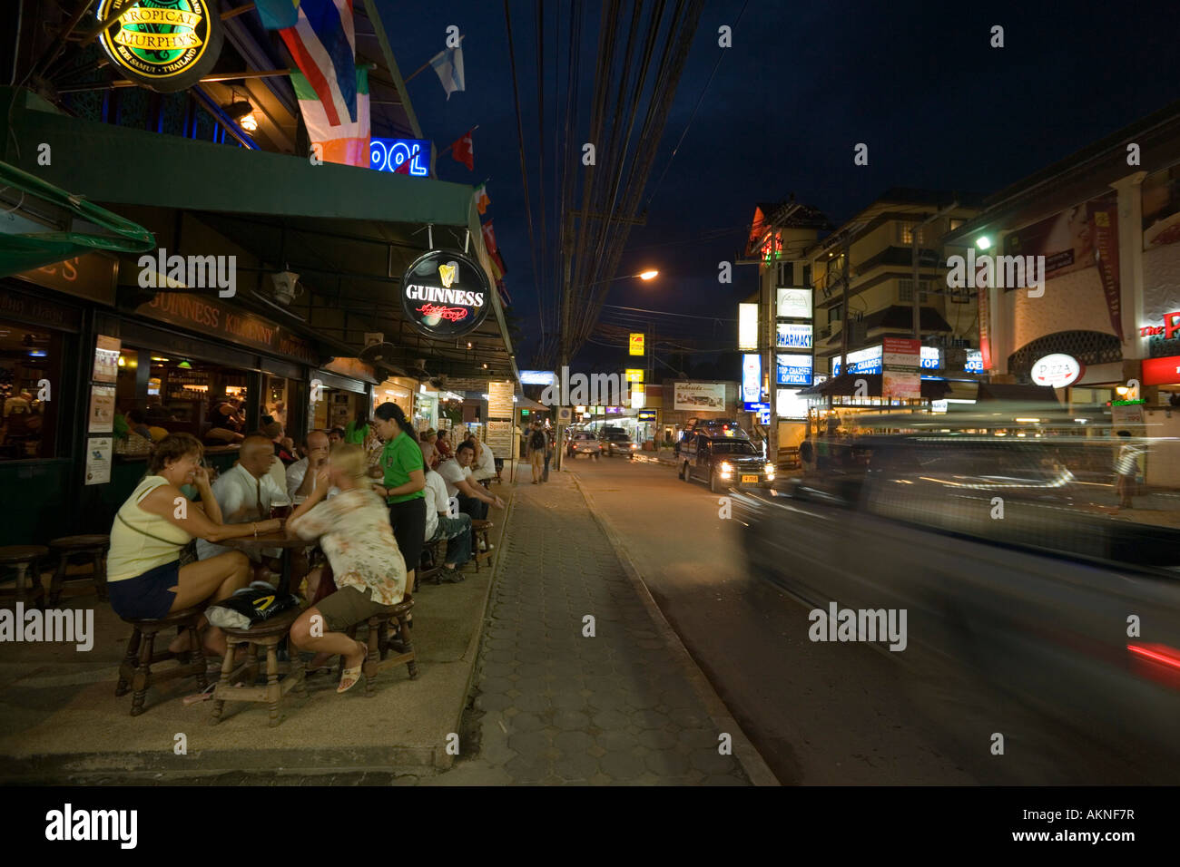 People sitting in the open air area of the Tropical Murphy s Irish Pub Chaweng Beach Hat Chaweng Central Ko Samui Thailand Stock Photo