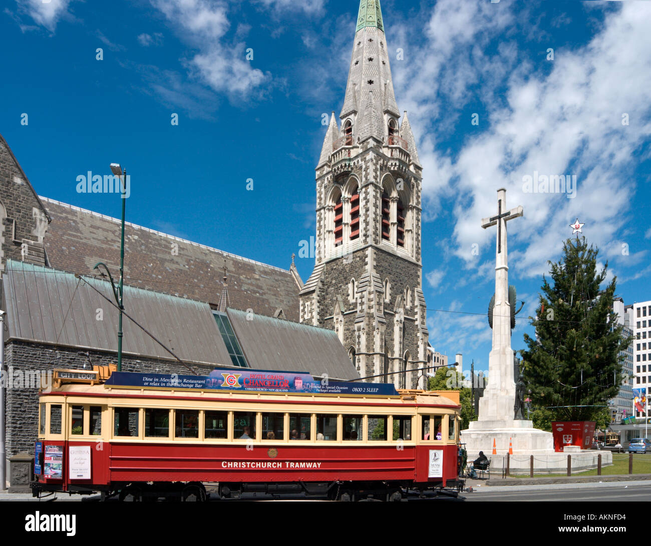 Traditional tram in front of Christchurch Cathedral, Christchurch, South Island, New Zealand. Image taken before the 2011 earthquake. Stock Photo