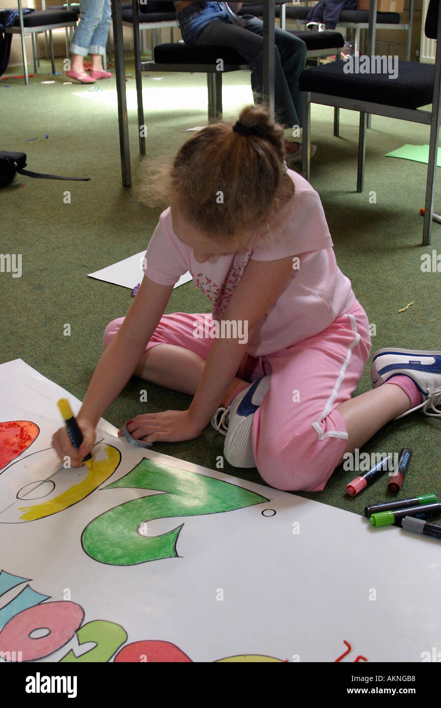 Poster Making Girl girl designing a poster in a community centre in carlisle uk Stock ...