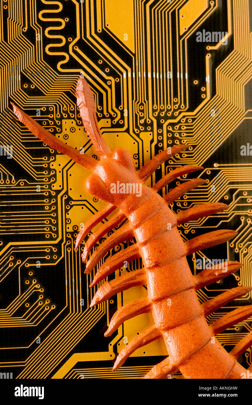 Digital close up photograph of a computer circuit board with a bug crawling over it Stock Photo