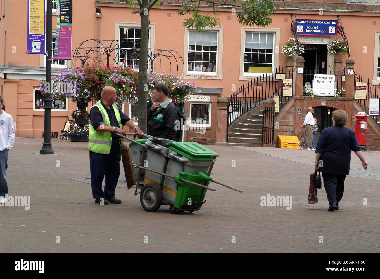 man cleaning the street in a town centre in the uk Stock Photo Alamy