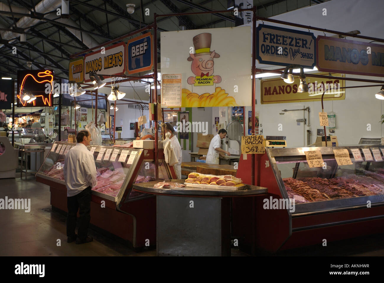 Butchers in indoor market. St Lawrence market, Toronto, Ontario, Canada