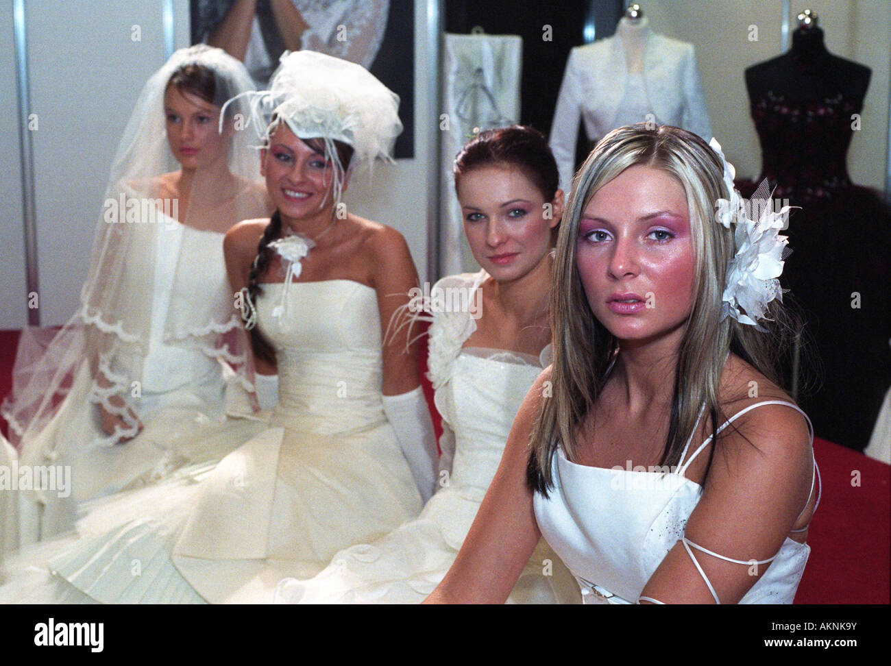 Young students dressed up as brides at a wedding fair in Poznan, Poland Stock Photo
