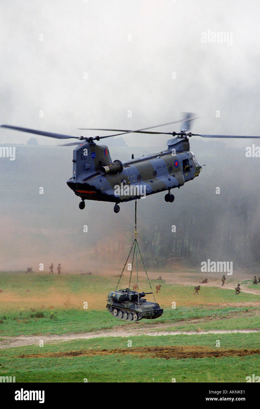 Chinook helicopter lifts a tank at display given by the 5th Airborne Brigade at Salisbury Plain Wiltshire UK Stock Photo
