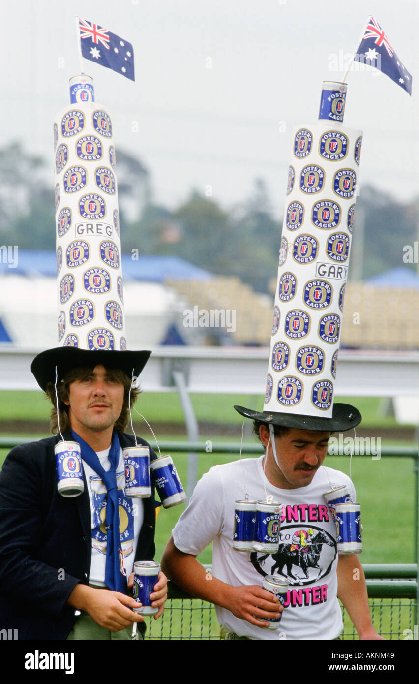 Supporters wearing oversized Fosters hats at the Melbourne Cup Australia Stock Photo