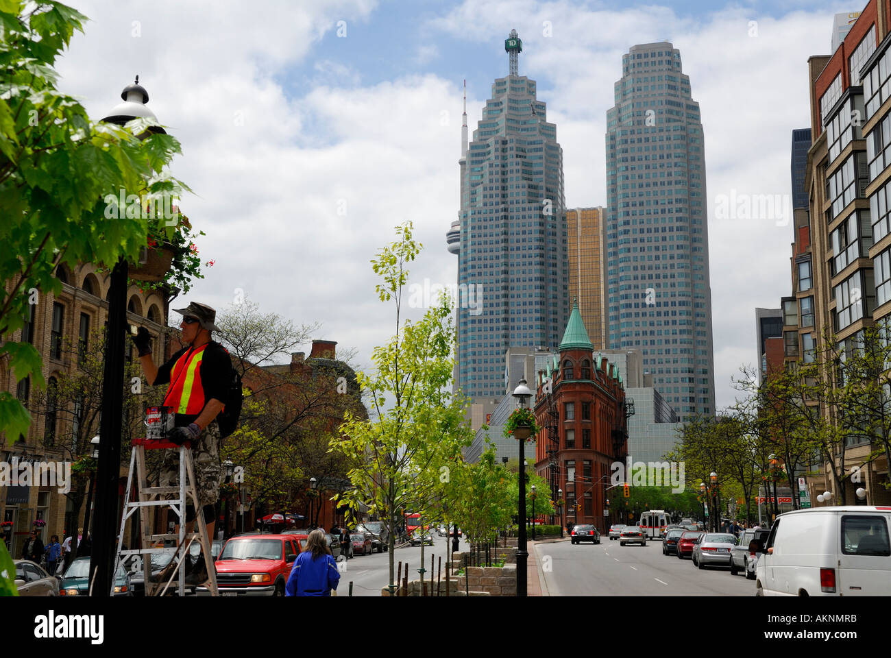 Spring maintenance on Front Street Toronto with Wellington Flatiron building and bank high rise towers Stock Photo
