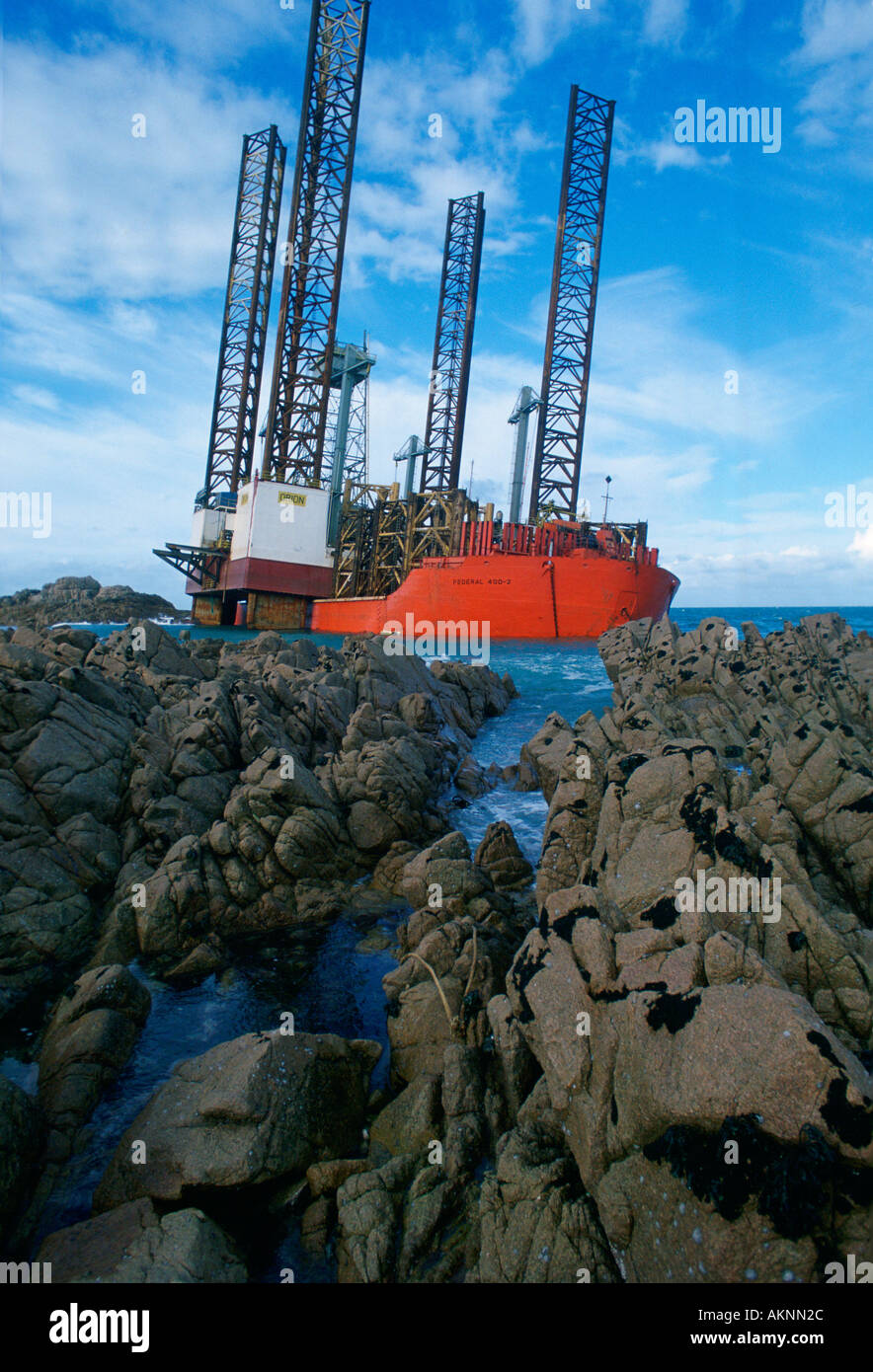 Oil rig Orion aground in Grandes Rocques Bay Guernsey Channel Islands Stock Photo