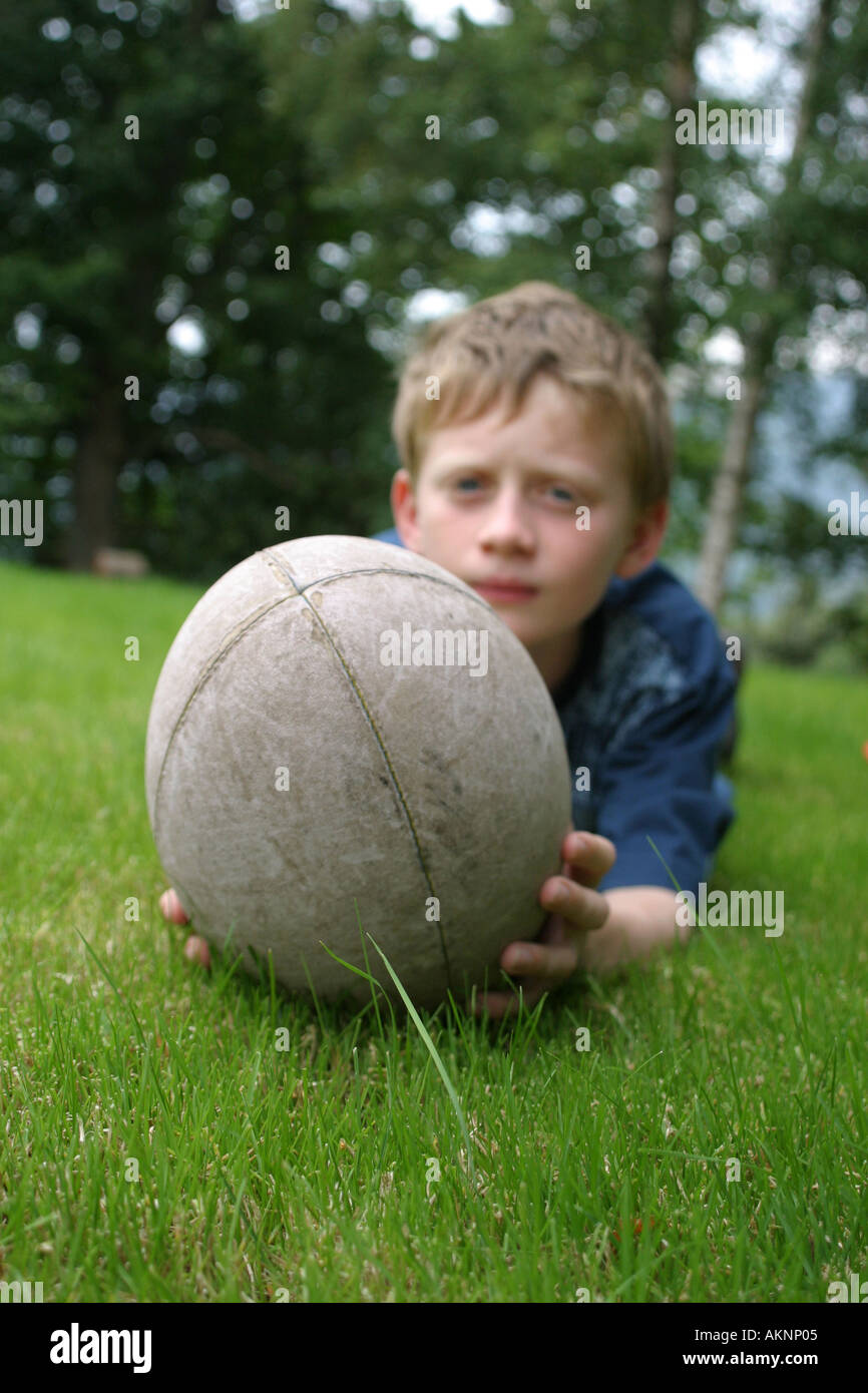 boy playing with a rugny ball Stock Photo Alamy