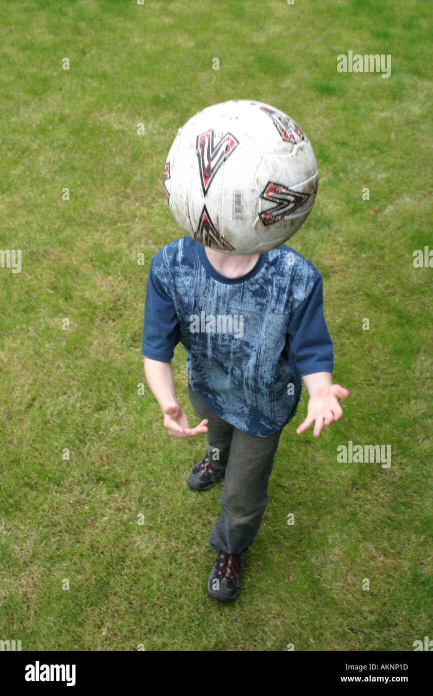 boy heading a football Stock Photo Alamy