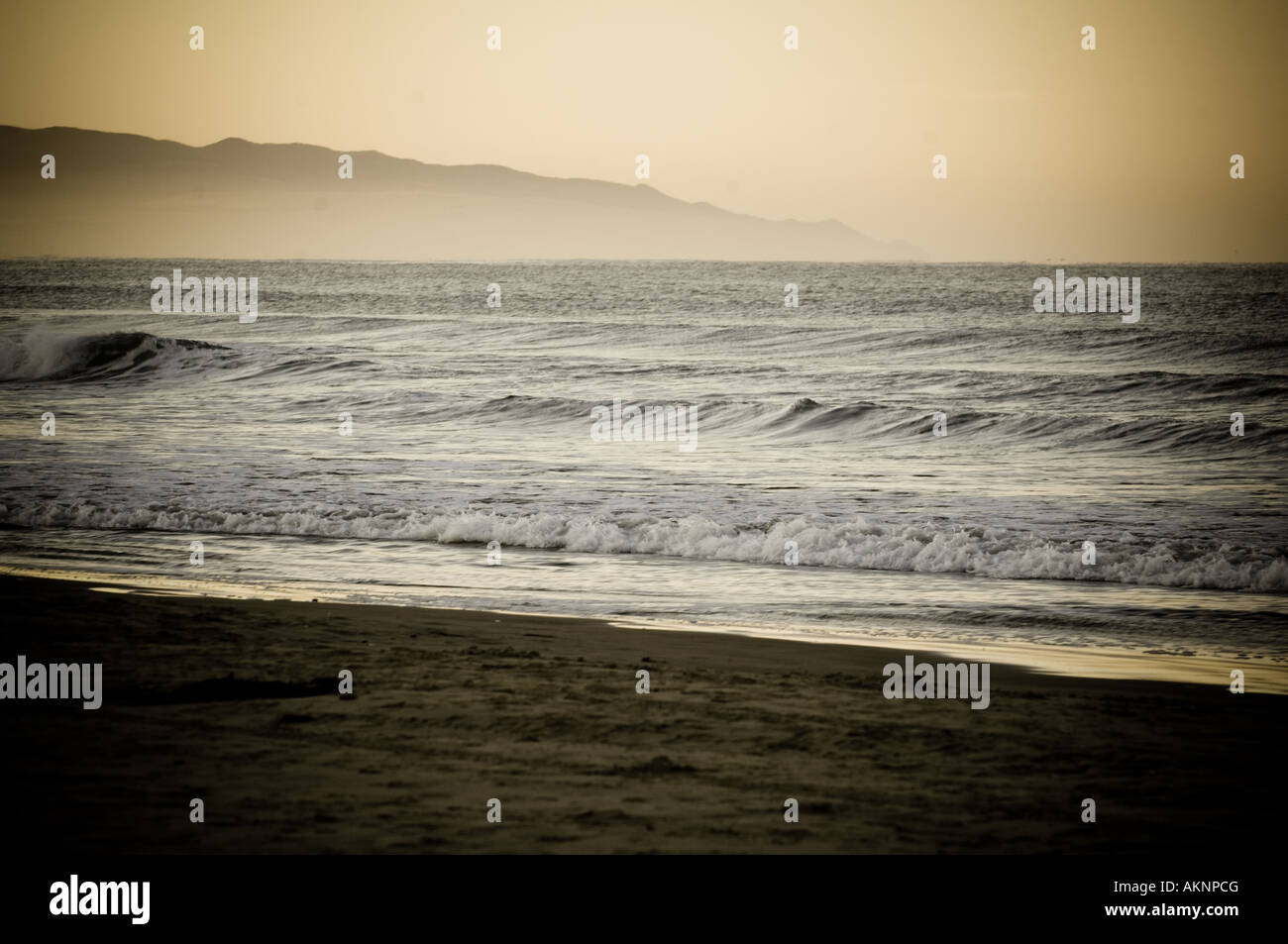 Waves breaking on the beach Stock Photo - Alamy