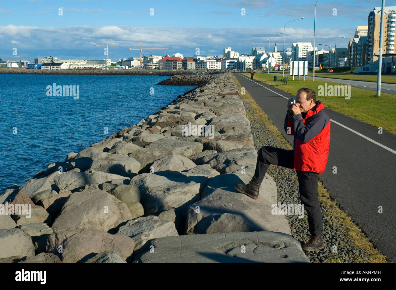 Tourist Taking A Photograph On The Waterfront Reykjavik Iceland Stock Tourist Taking A Photograph On The Waterfront Reykjavik Iceland Stock