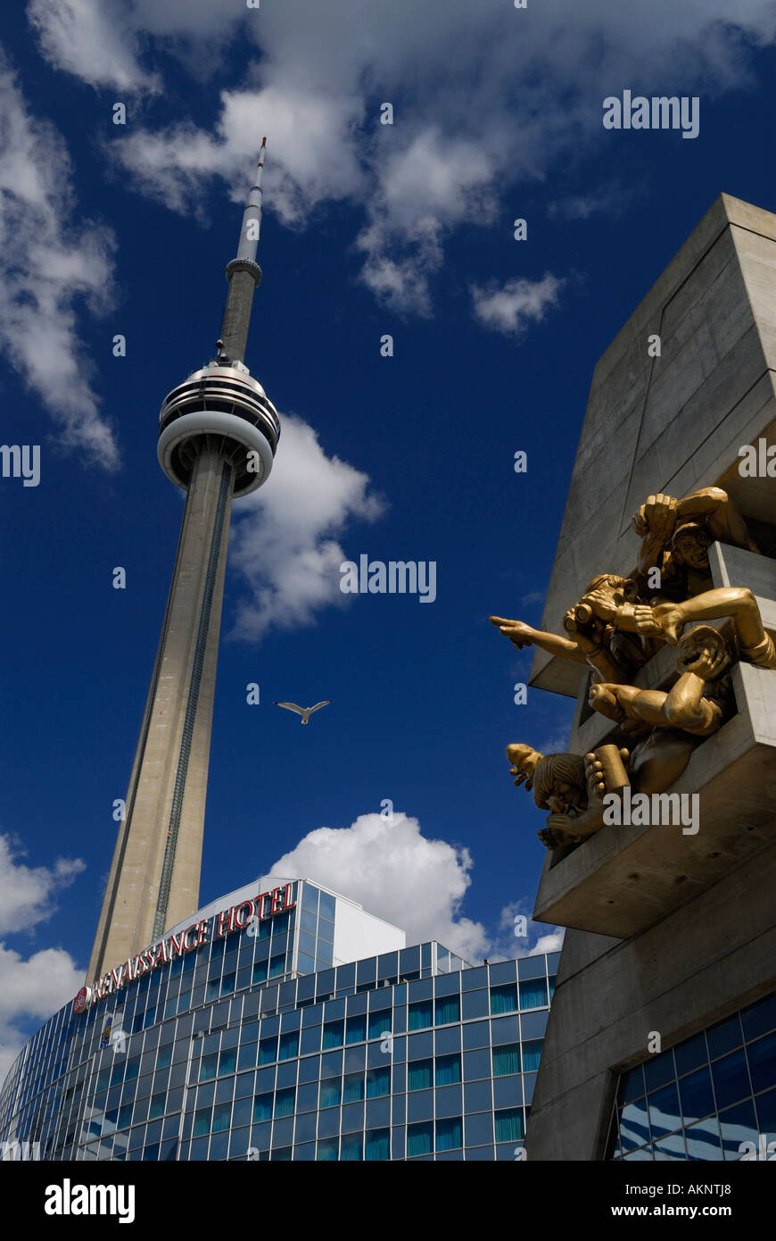 CN tower with sculpture of sports fans at Skydome Rogers Centre stadium downtown Toronto Stock Photo