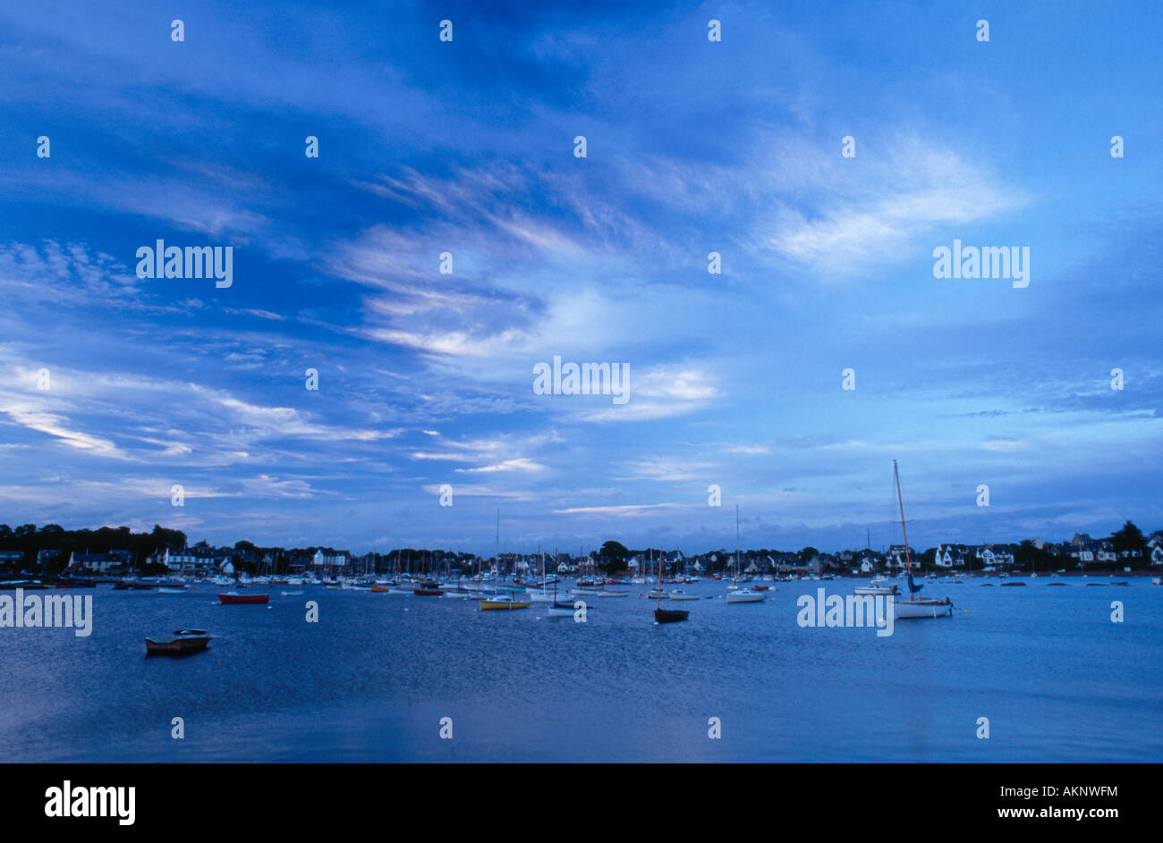 Blue sky and clouds over Tregastel harbour, Brittany, France Stock Photo
