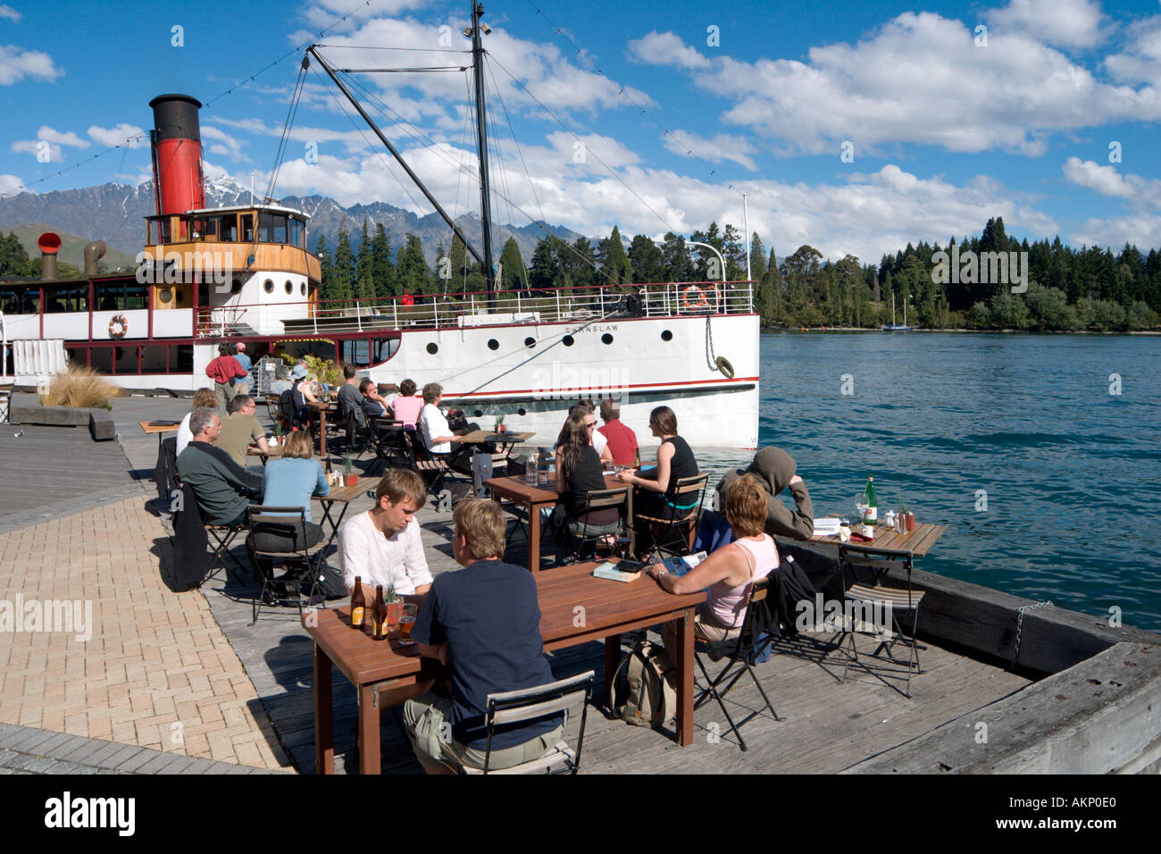 Lakeside Cafe Bar with the steamship SS Earnslaw behind,  Lake Wakatipu, Queenstown, South Island, New Zealand Stock Photo