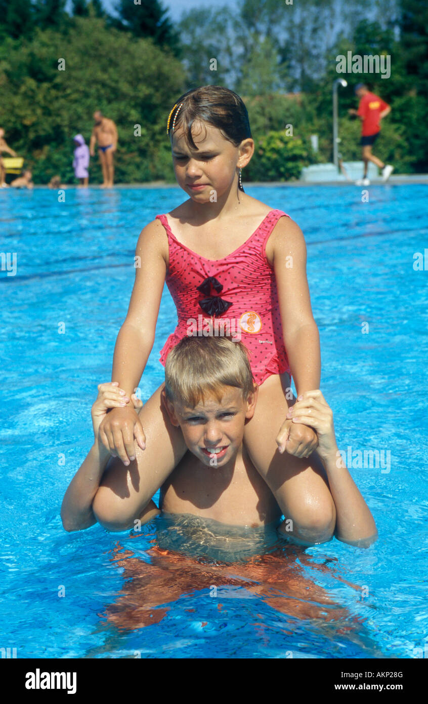 portrait of a brother and his younger sister at an open air bath Stock ... pic