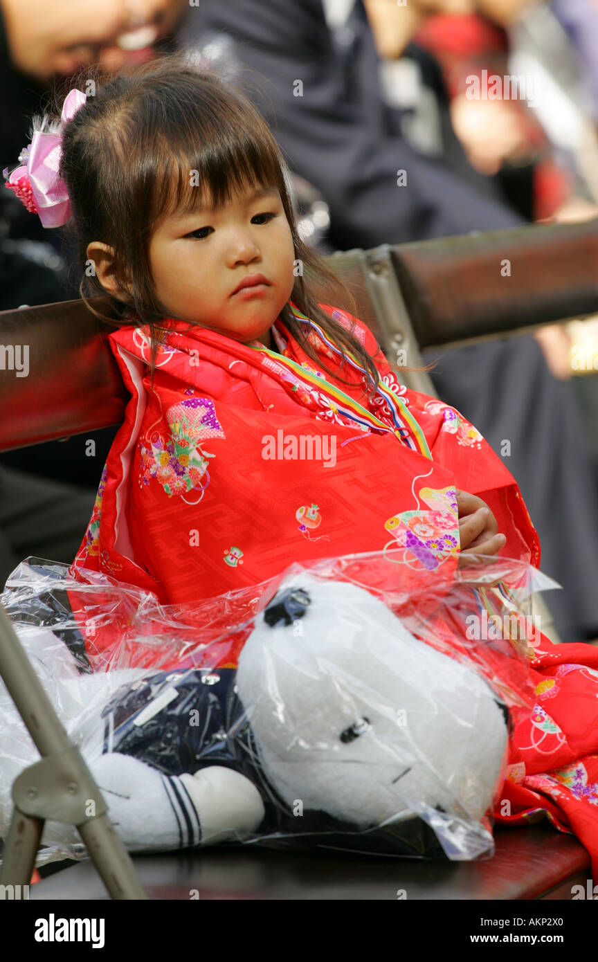 Young Japanese Girl In Traditional Kimono Yukata Dress Waiting For Her Shichi Go San Rights Of Passage Festival Temple Blessing Stock Photo Alamy