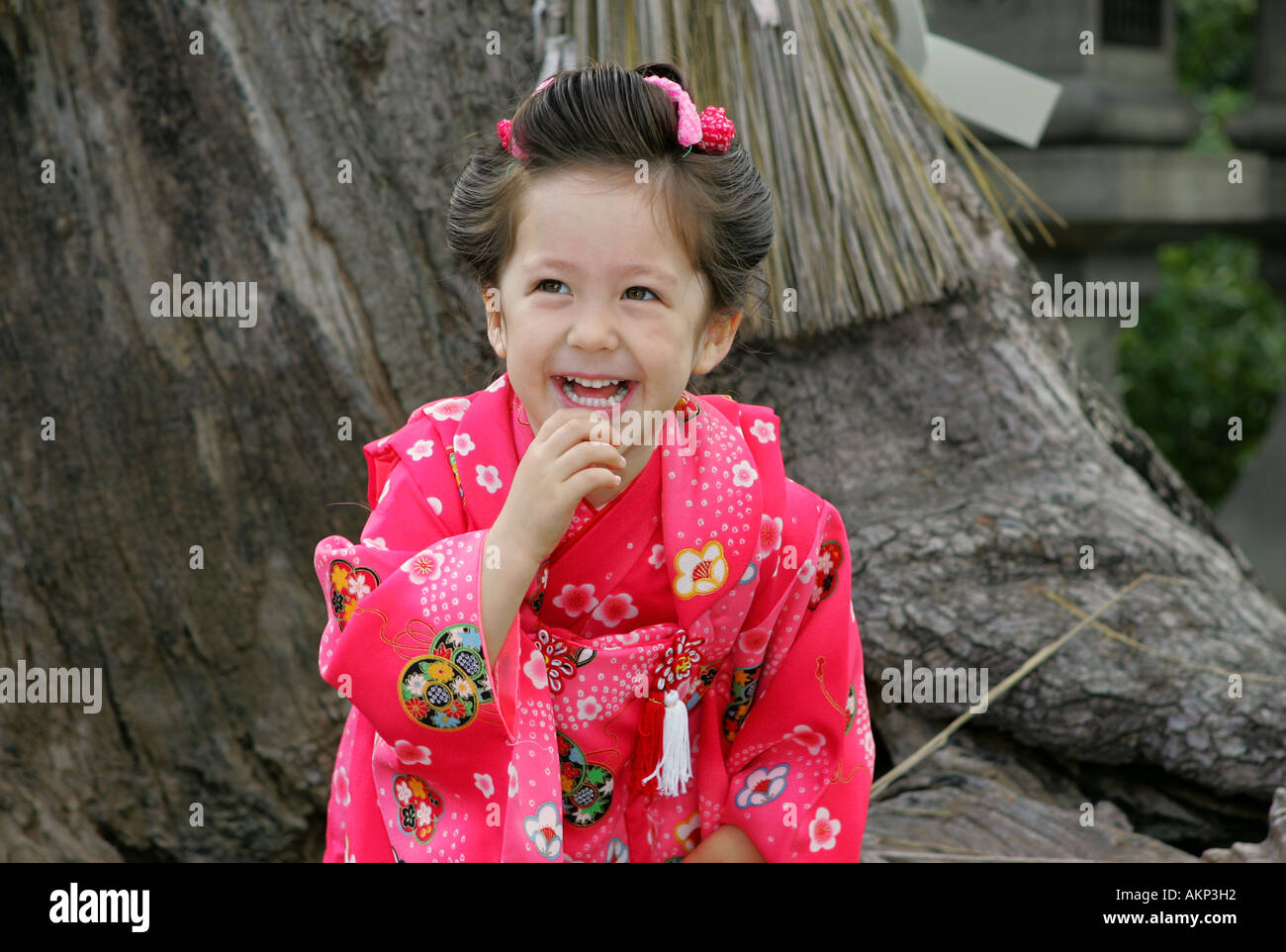 Cute Japanese Australian multicultural mixed race young girl dressed in