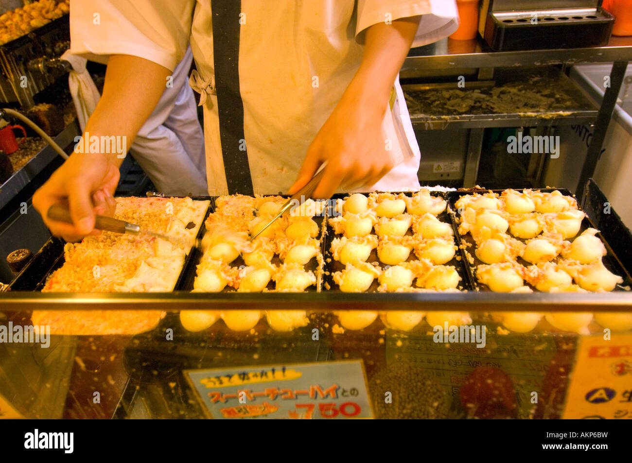 Takoyaki shop and bar takoyaki is a sort of pancake filled with boiled octopus Osaka Japan Stock Photo