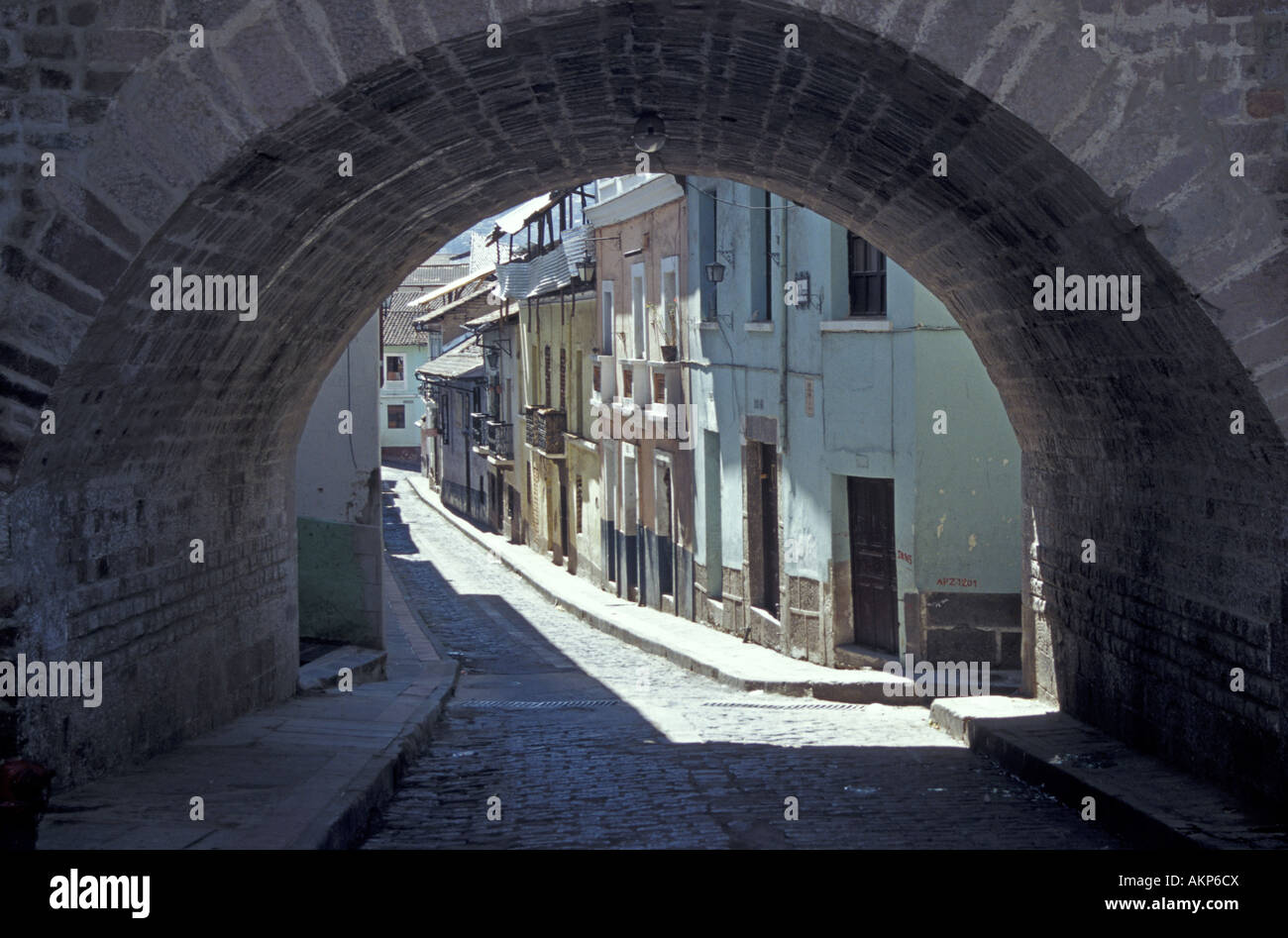 La Ronda alley framed by an arched bridge in in the Old Town, Quito, Ecuador Stock Photo