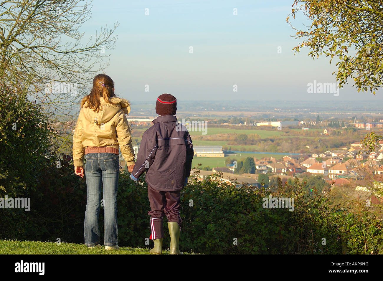 brother and sister holding hands, overlooking the countryside Stock ...