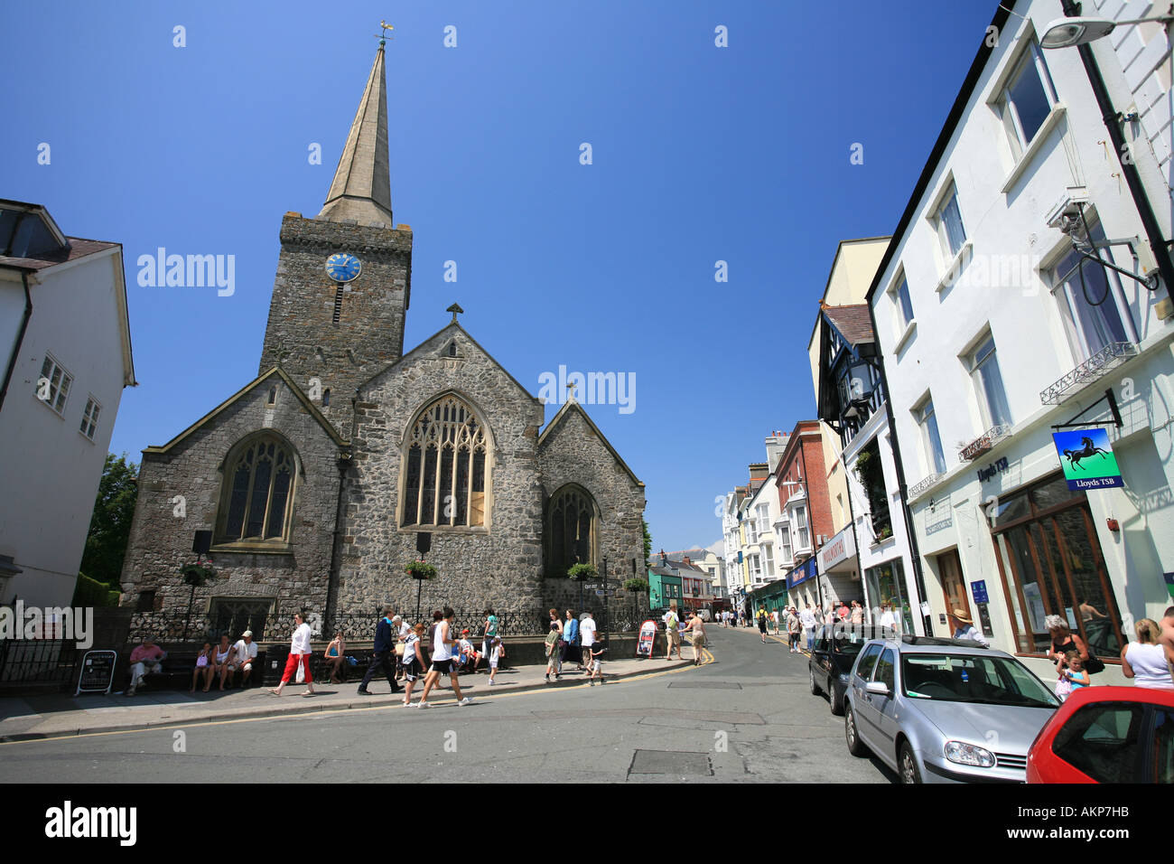 Tenby town centre with tourists exploring the small shops boutiques and cafes West Wales Uk Britain Europe Stock Photo