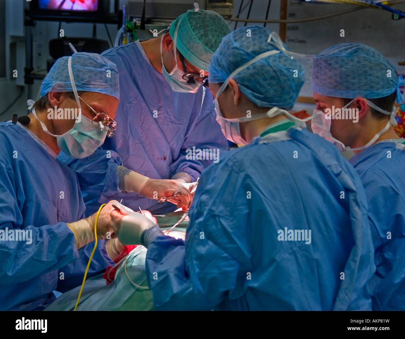 Plastic surgeons operating on a patient Stock Photo