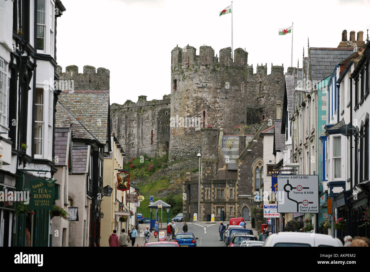 Ancient Conwy castle viewed from main street of Conwy town centre Snowdonia North Wales UK GB Stock Photo