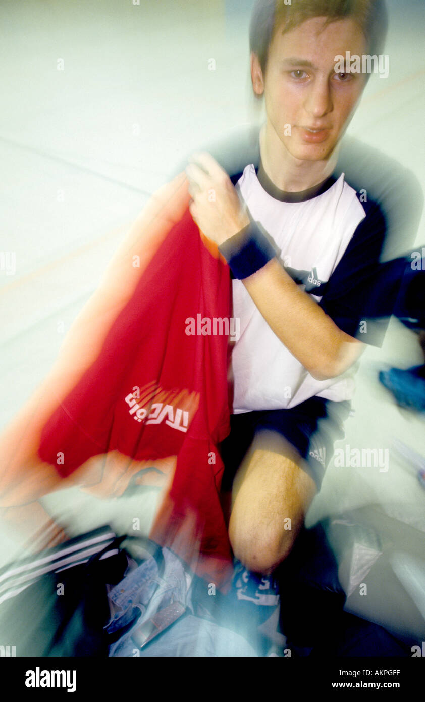 Germany Free time Portrait of a young man in a gymnasium he is changing clothes  Stock Photo