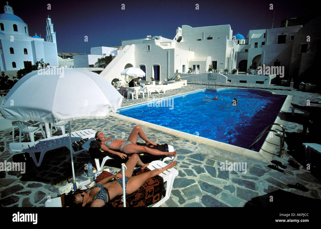 Santorini sunbathing in the midst of the typical architecture Stock Photo