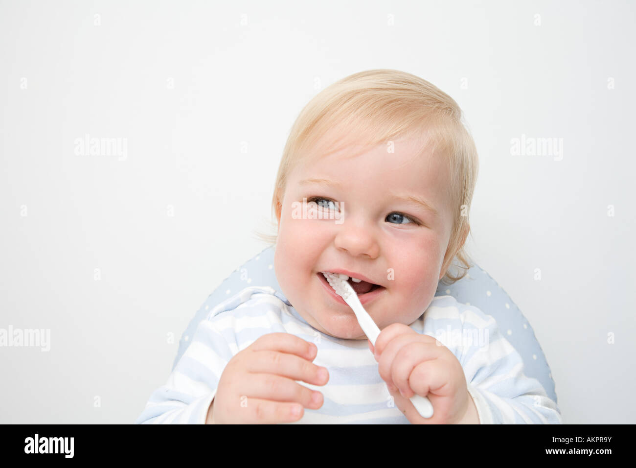A baby boy brushing his teeth Stock Photo Alamy