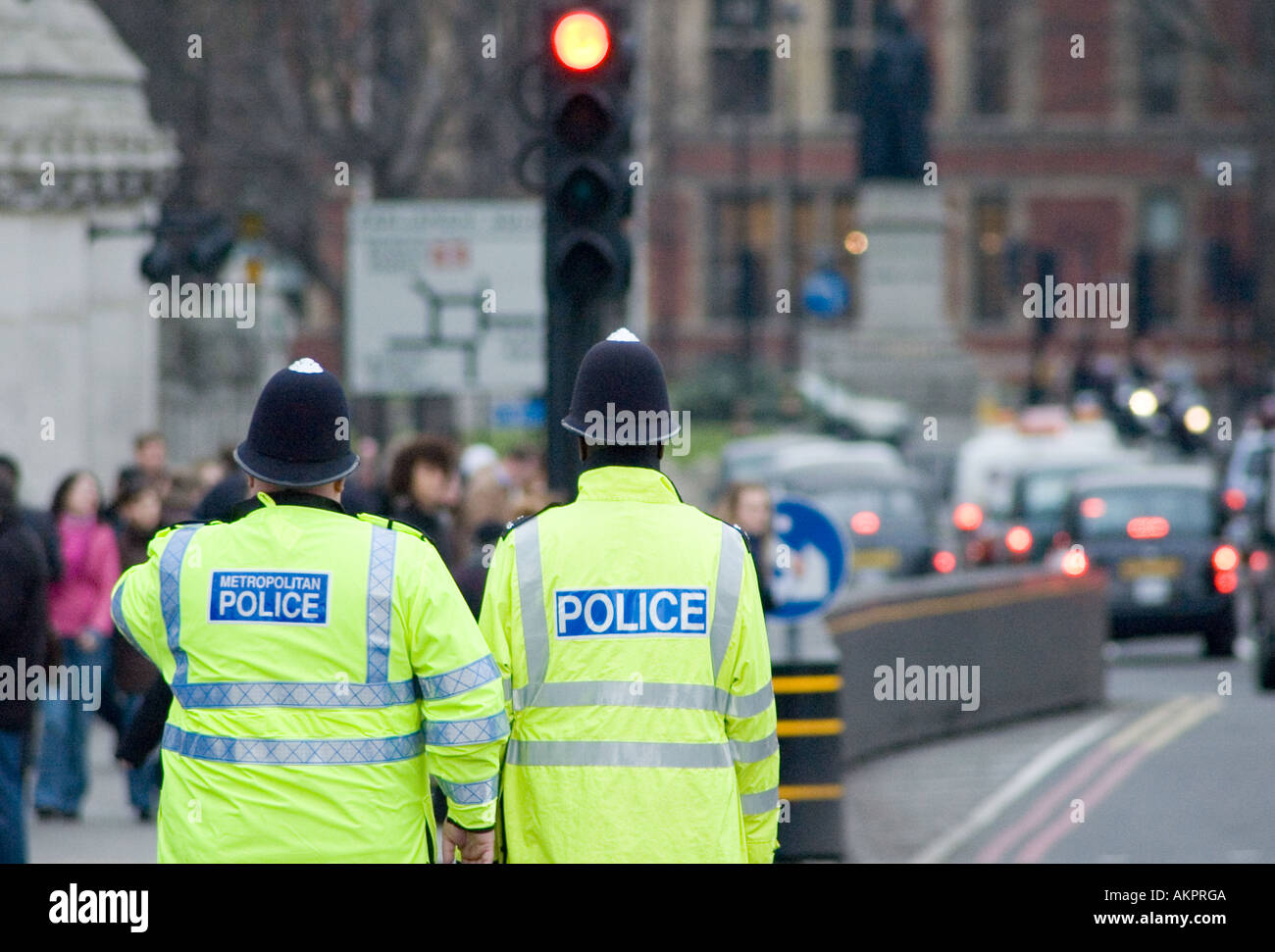 Two London Bobbies on duty at Westminster Bridge in London Stock Photo