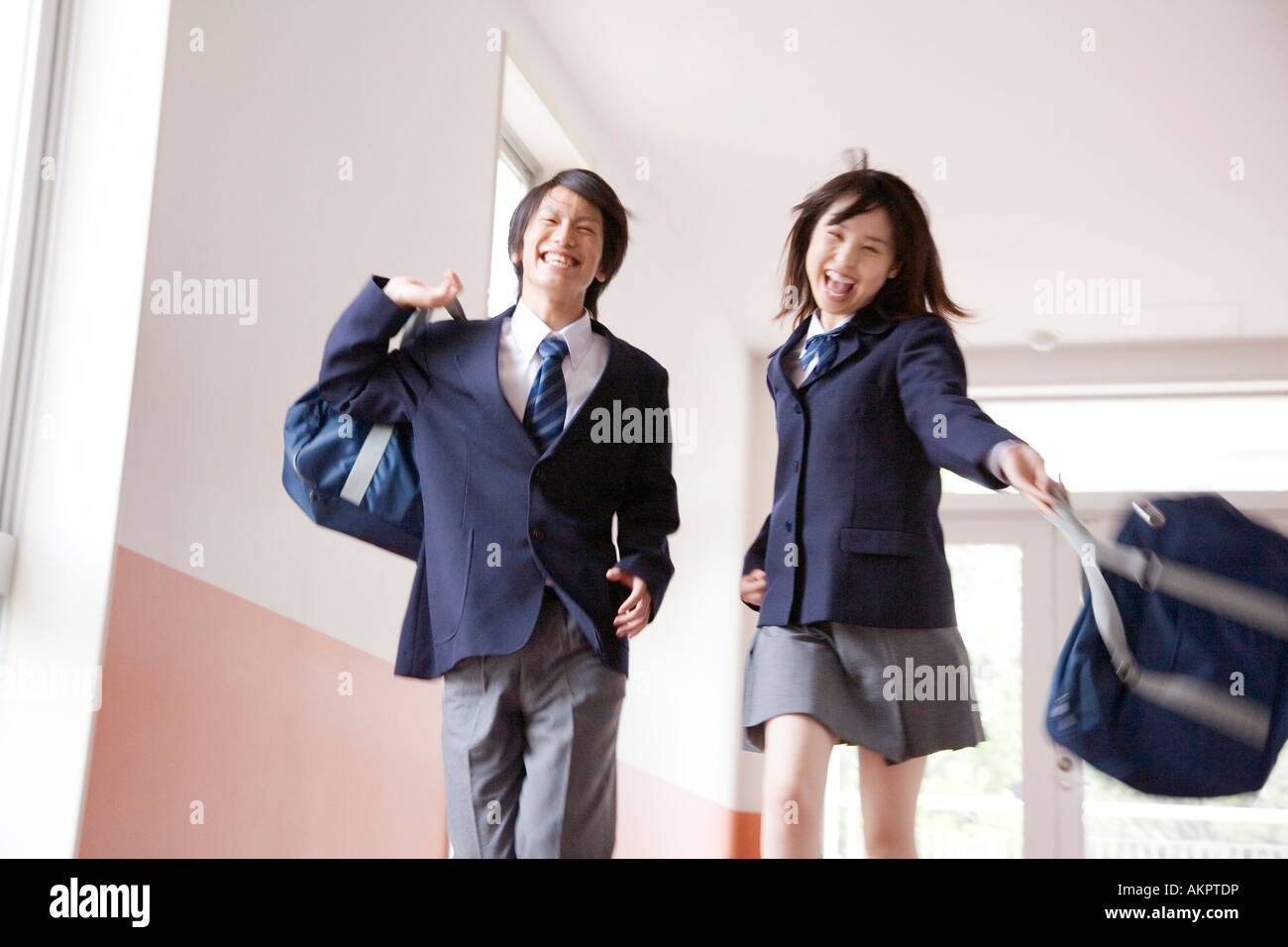 High school students walking the corridor Stock Photo