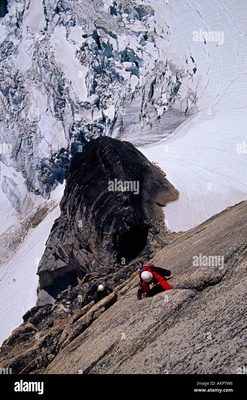 rock climbers climbing Southwest Ridge on Snowpatch Spire, Bugaboos, British Columbia, Canada Stock Photo