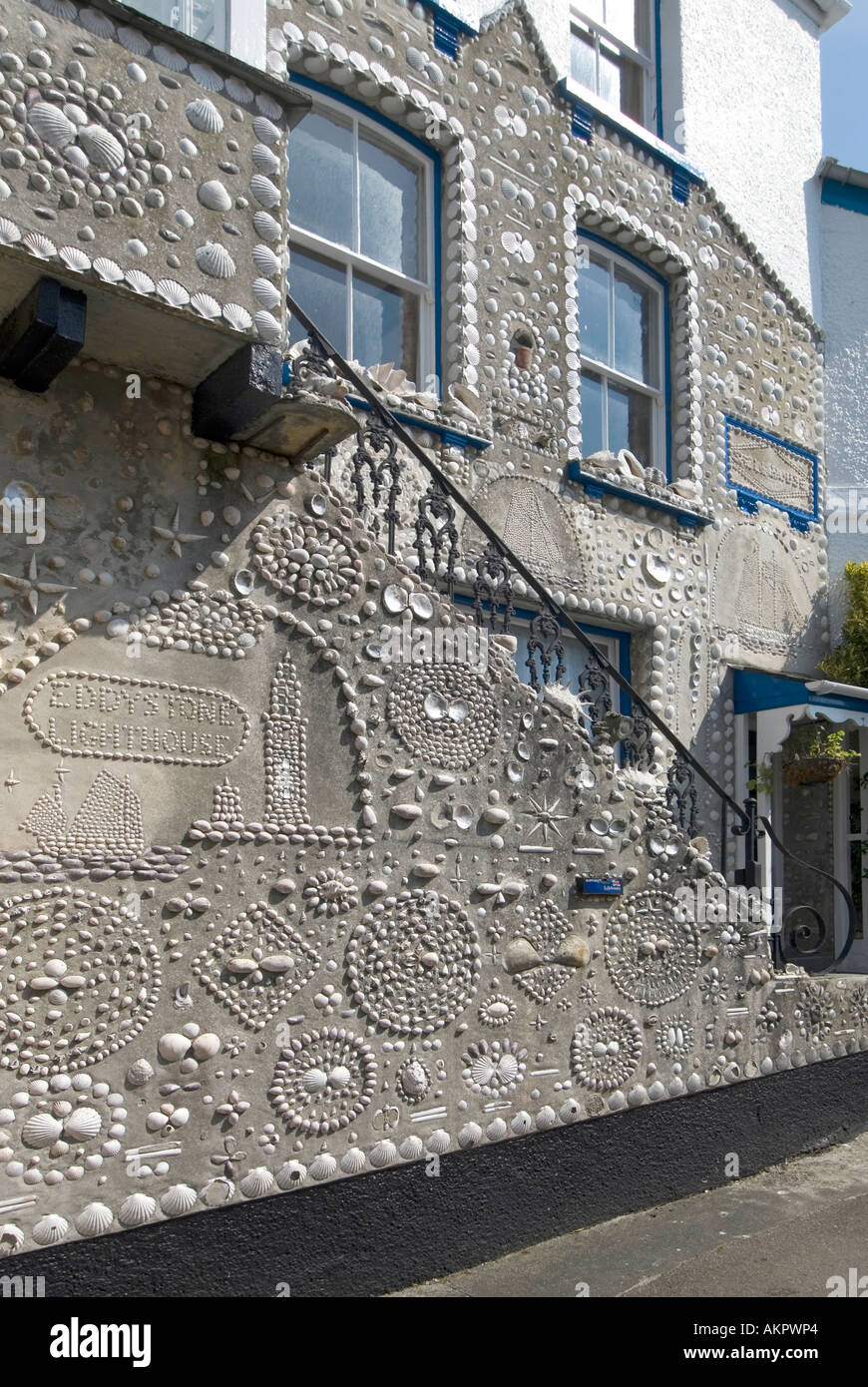 Polperro cottage with walls decorated with seashells Stock Photo