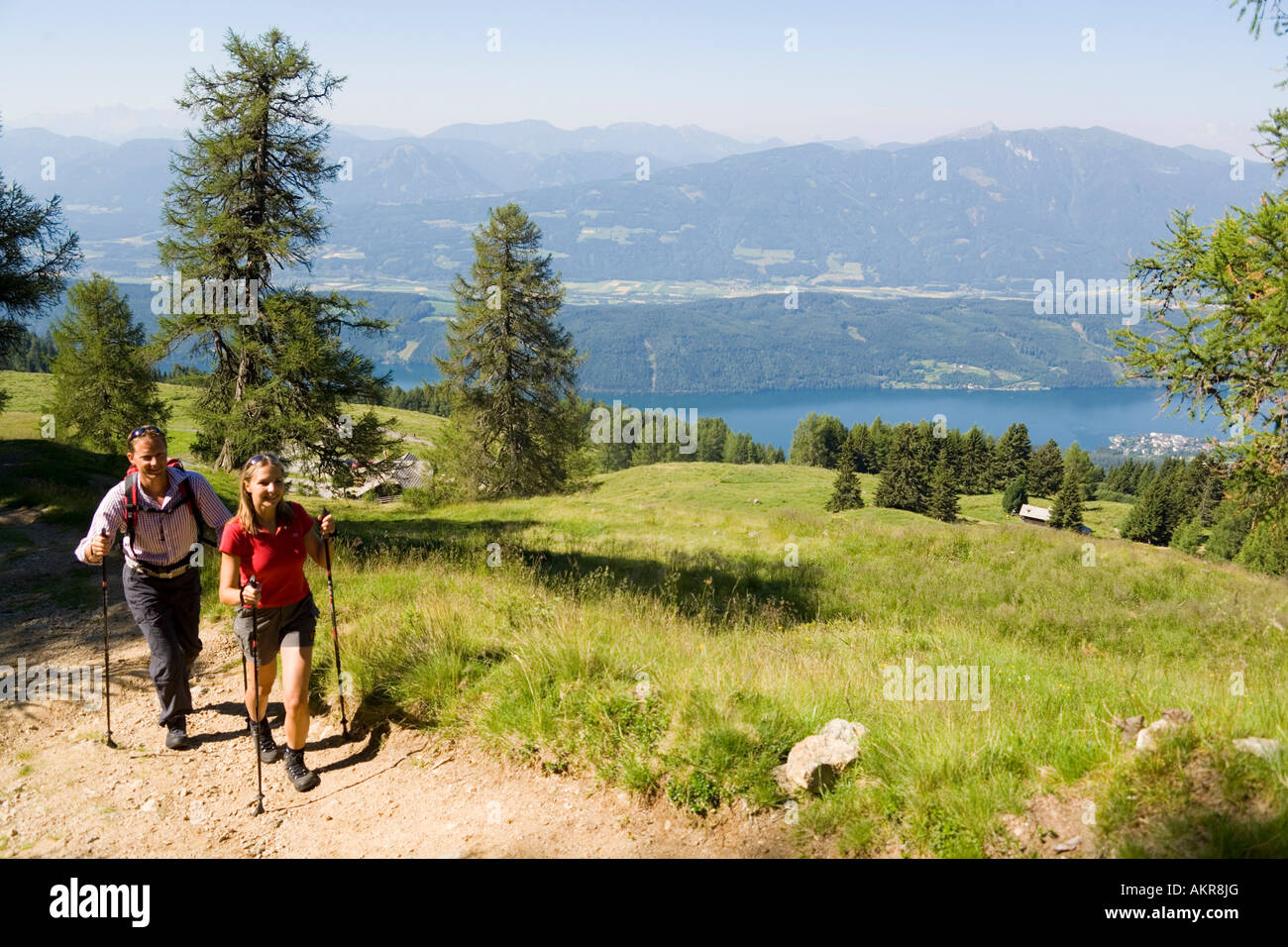 Couple Hiking Upside Millst Tter See Near Millstatt Carinthia Austria Stock Photo Alamy