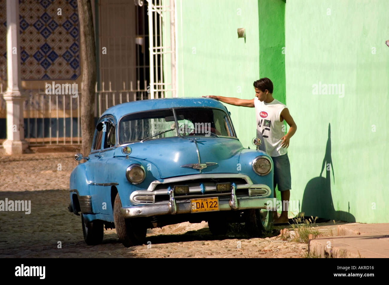Young man Cleaning old Car Stock Photo Alamy