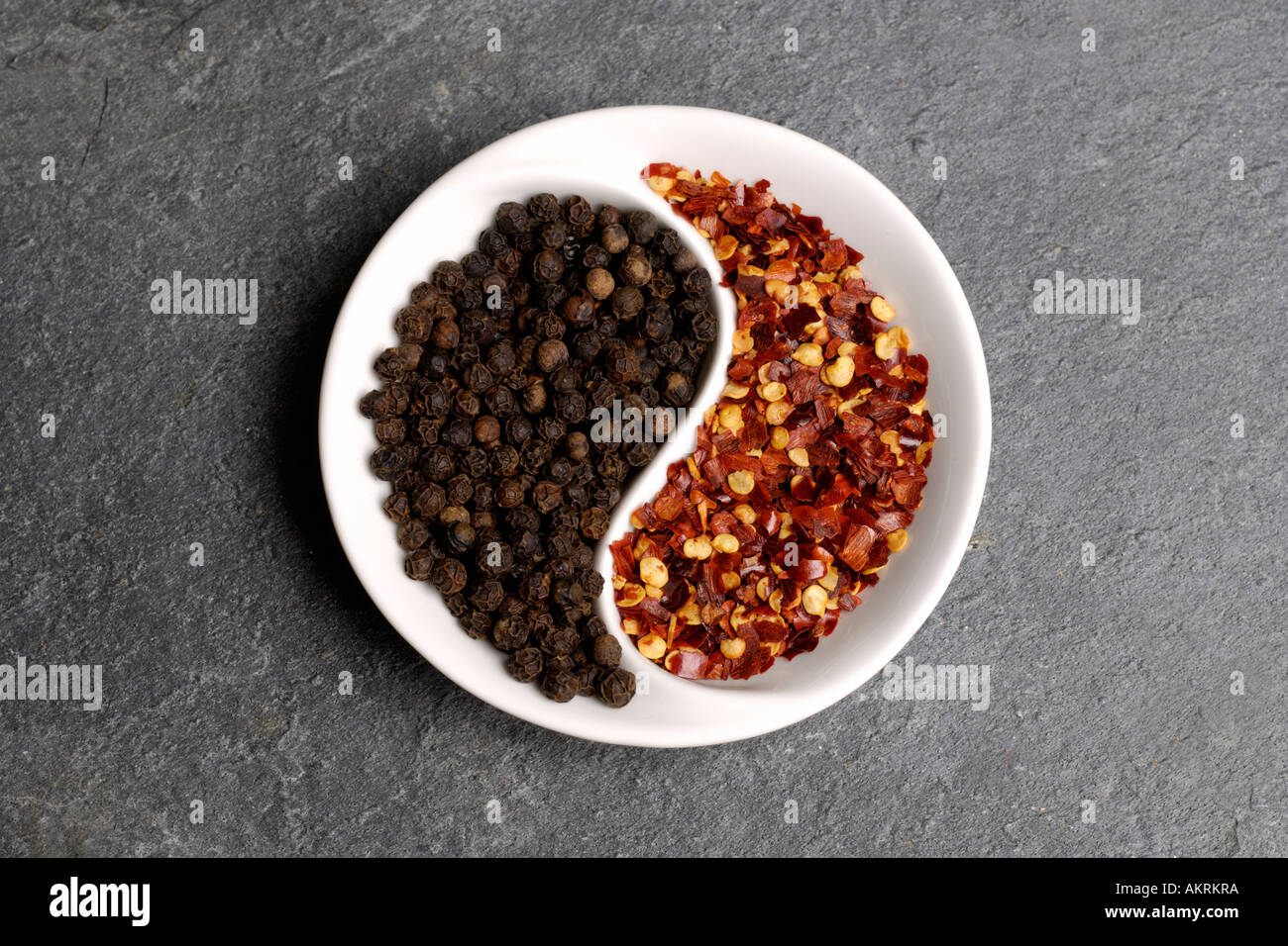 Black peppercorns and crushed red chillies Stock Photo Alamy