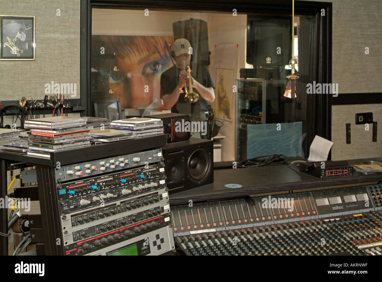 working in recording studio musician with musical instrument trumpet trump  in a studio Stock Photo - Alamy