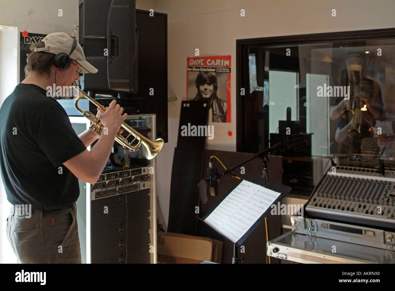 working in recording studio musician with musical instrument trumpet trump playing in a studio Stock Photo