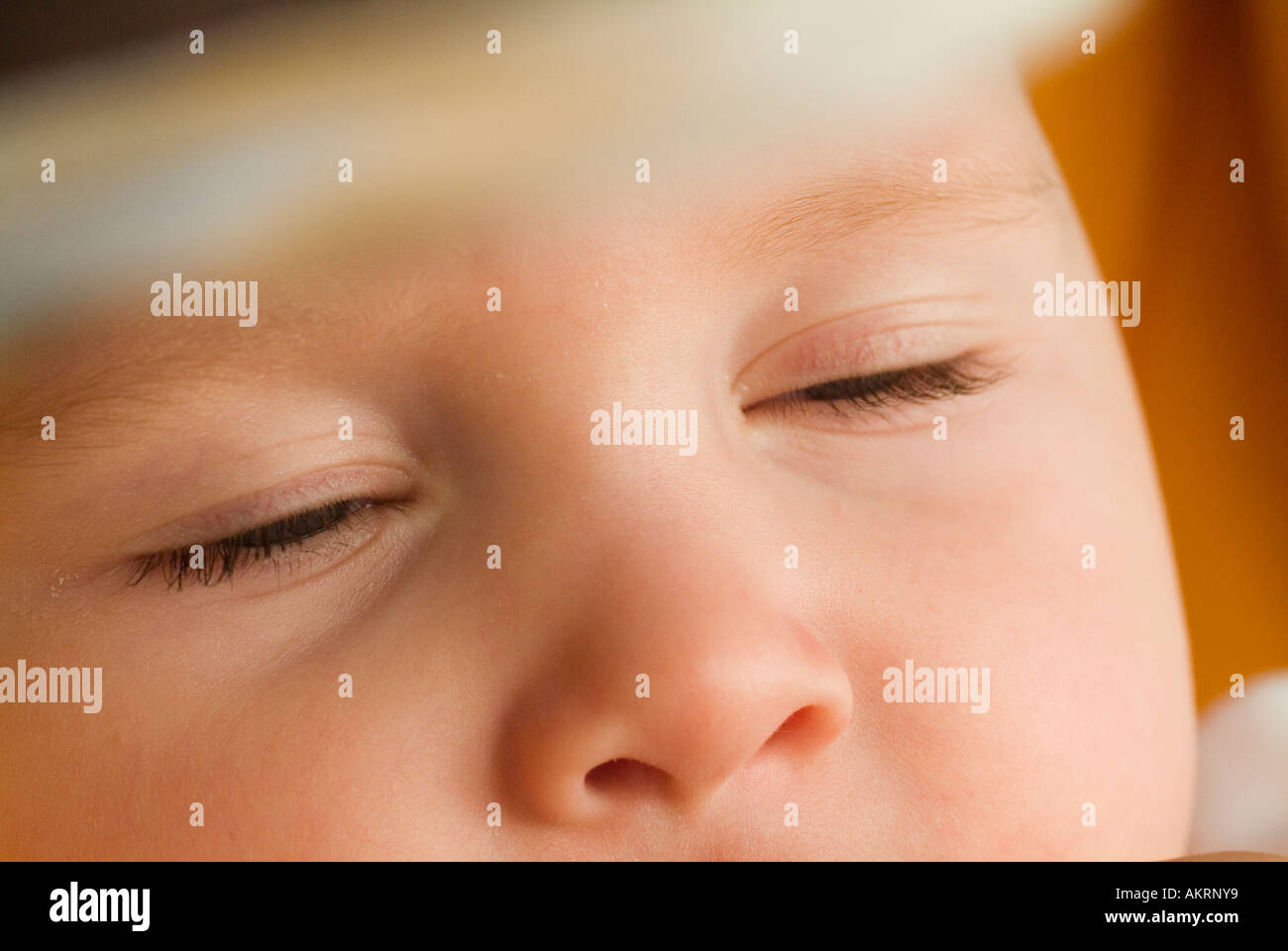 tired eyes of a baby of 8 months Stock Photo