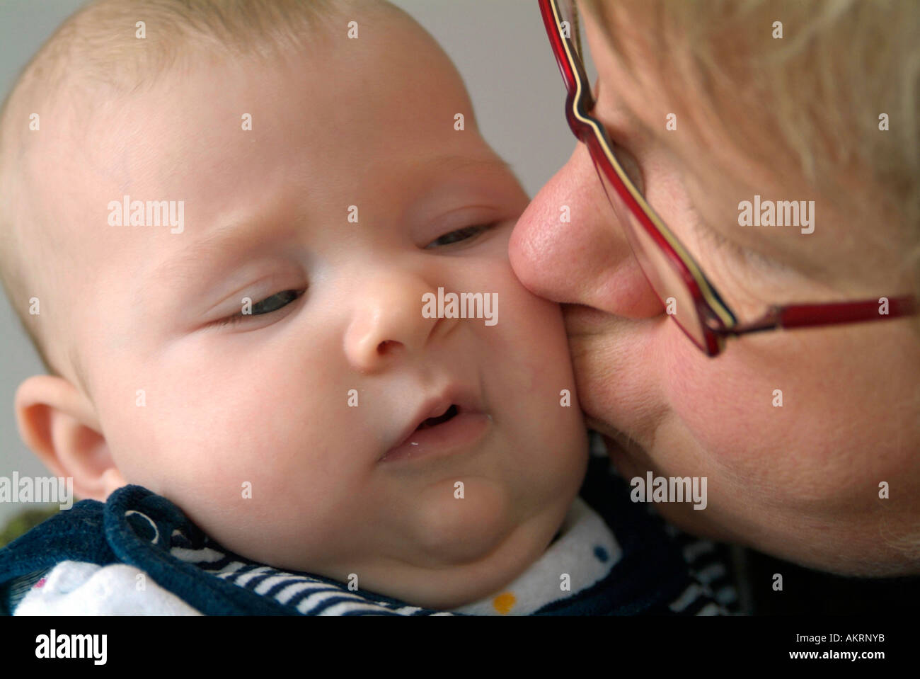 grandmother and grandchild baby of 6 months and a woman in age of about 45 to 50 years Stock Photo