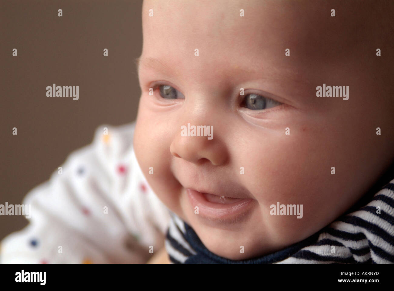 portrait of a baby of 6 months laughing Stock Photo