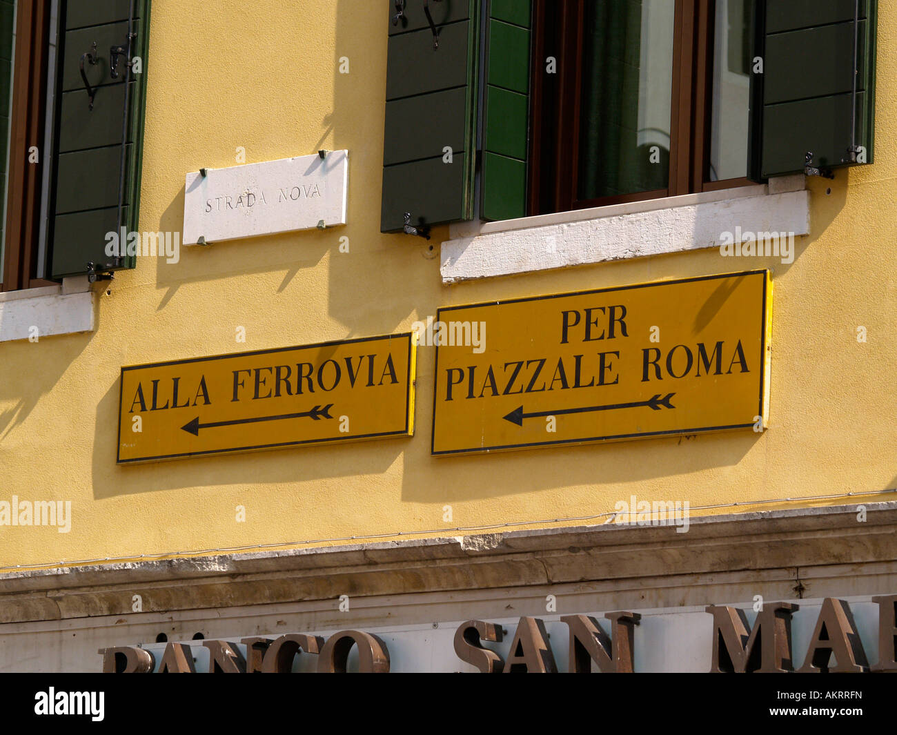 Signs for Ferrovia and Piazzale Roma, the train station and the main bus station. Venice Italy Stock Photo