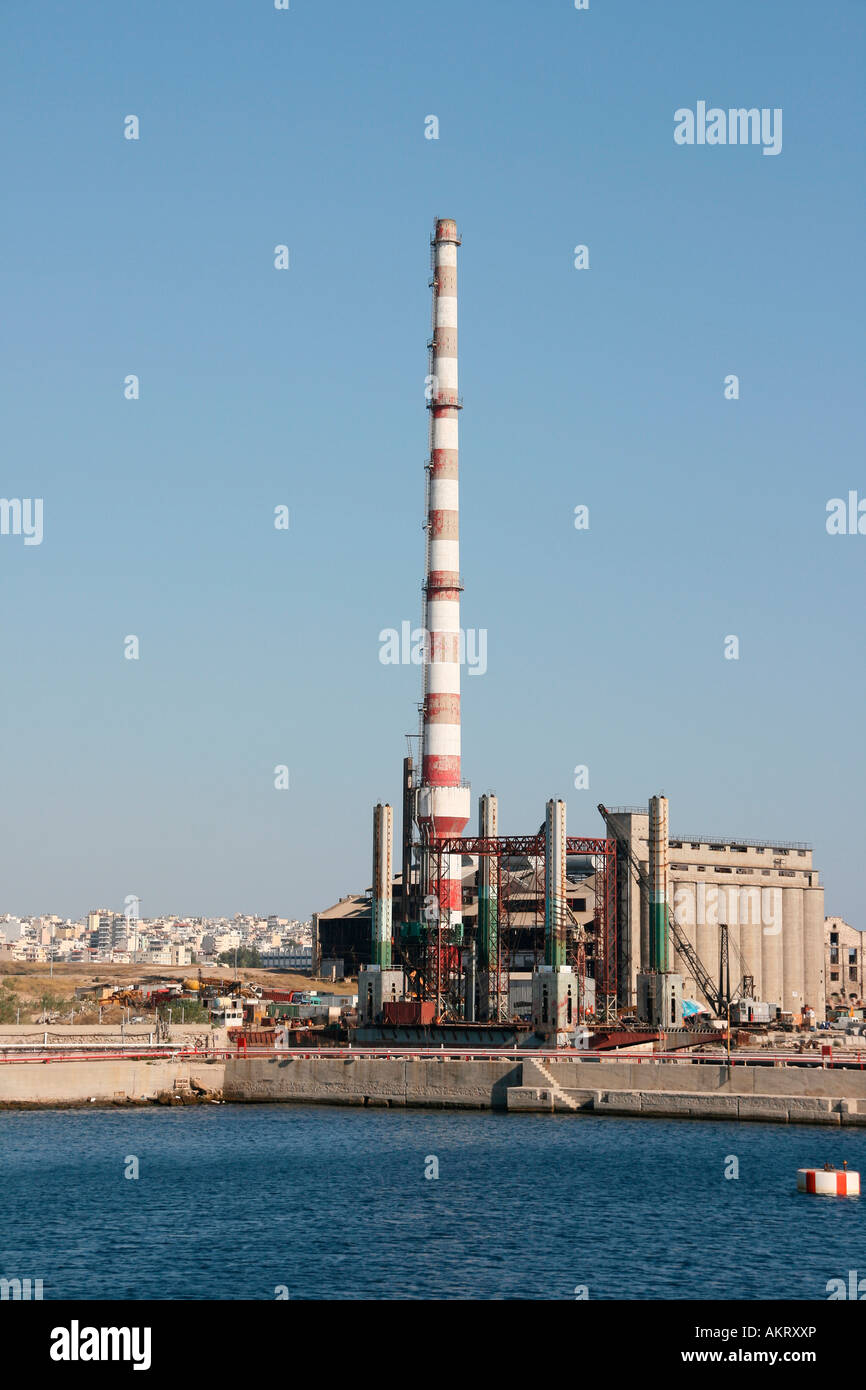 big red and white chimney in a factory plant by the sea in piraeus athens  greece Stock Photo - Alamy