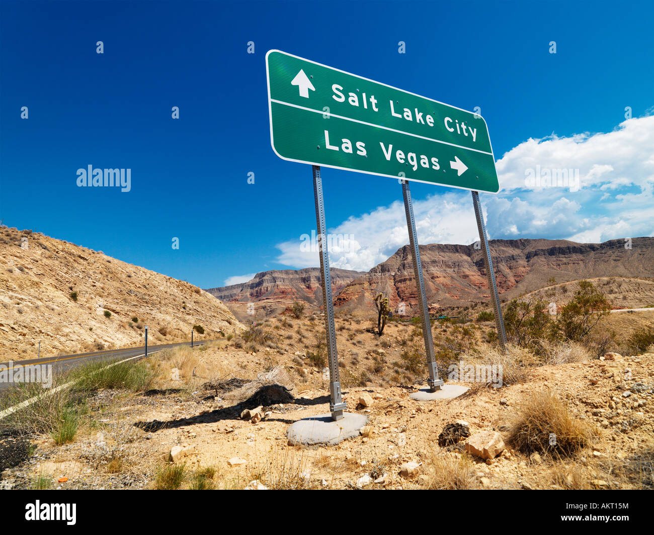 Road sign in desert pointing towards Salt Lake City and Las Vegas Stock Photo