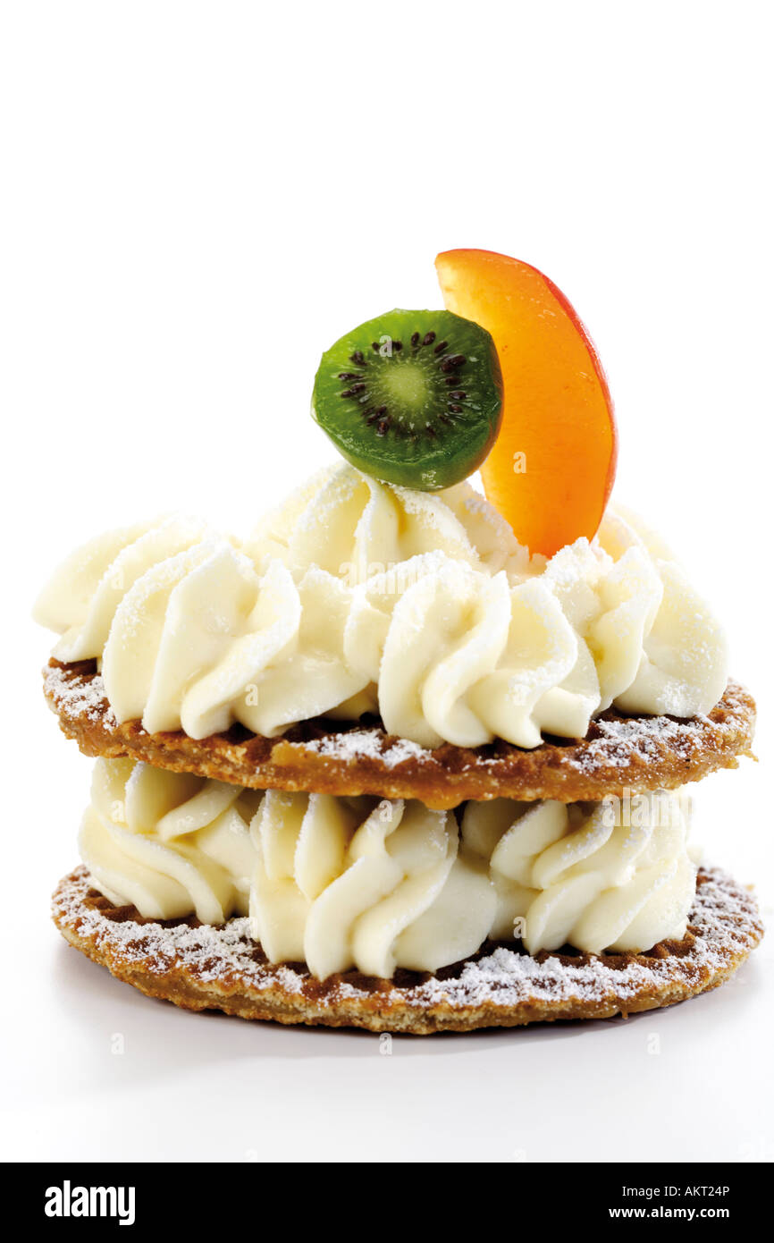 Caramel waffles with cream cheese and fruits, close-up Stock Photo