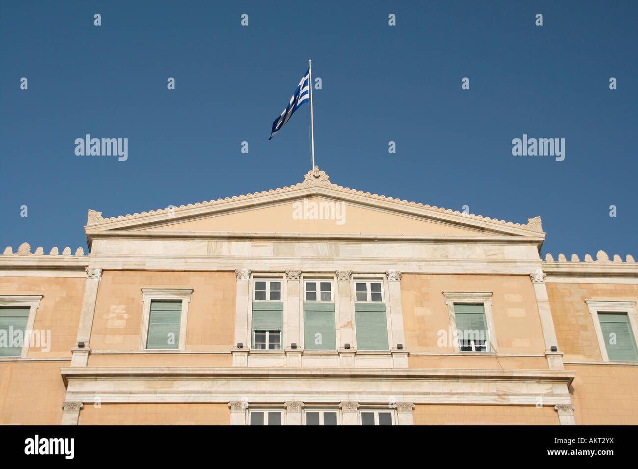 exterior detail from greek parliament with the flag on total blue sky landmakrs of athens greece Stock Photo