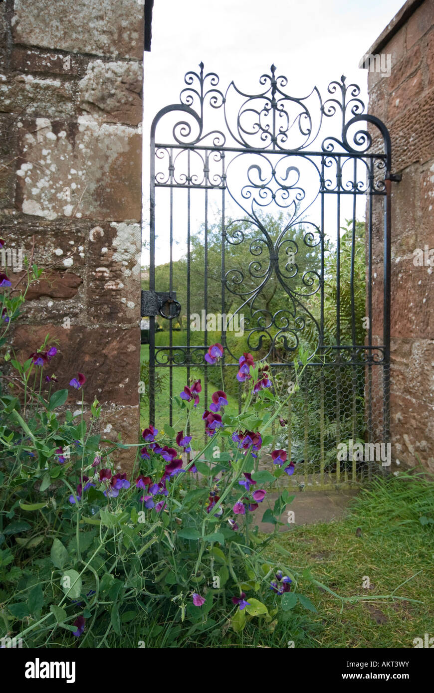 Opening wrought iron gate house hi-res stock photography and images - Alamy